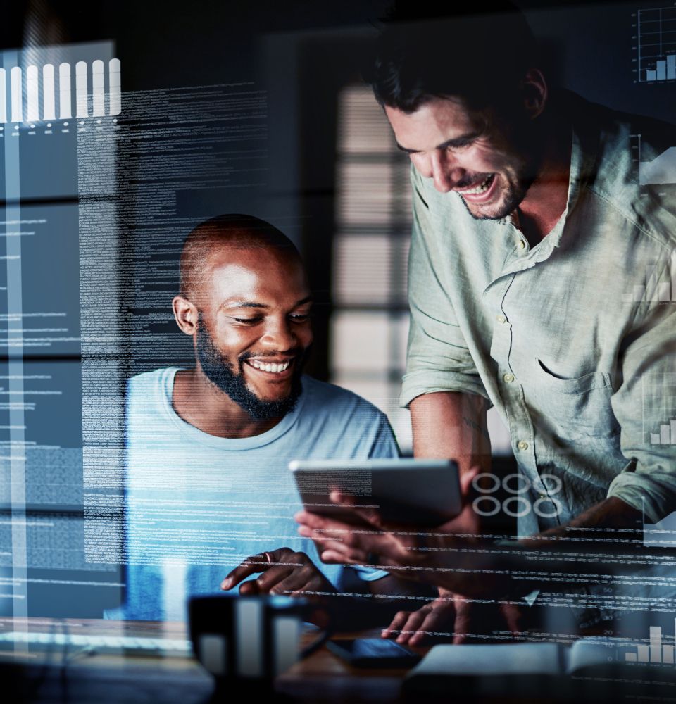 Two men smiling at tablet screen